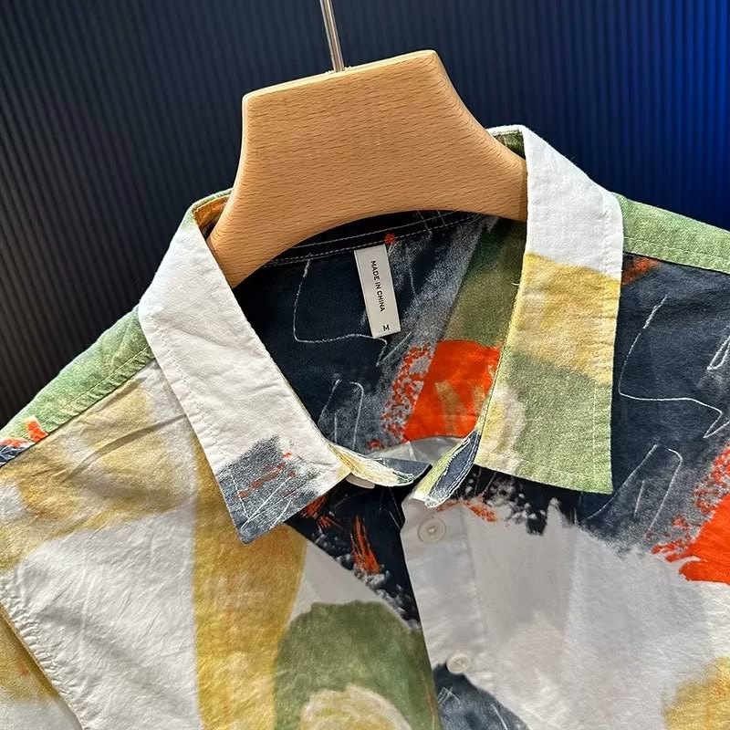 Close-up of the Forest Canvas collar and upper placket, showing the painted print and the texture of the cotton.